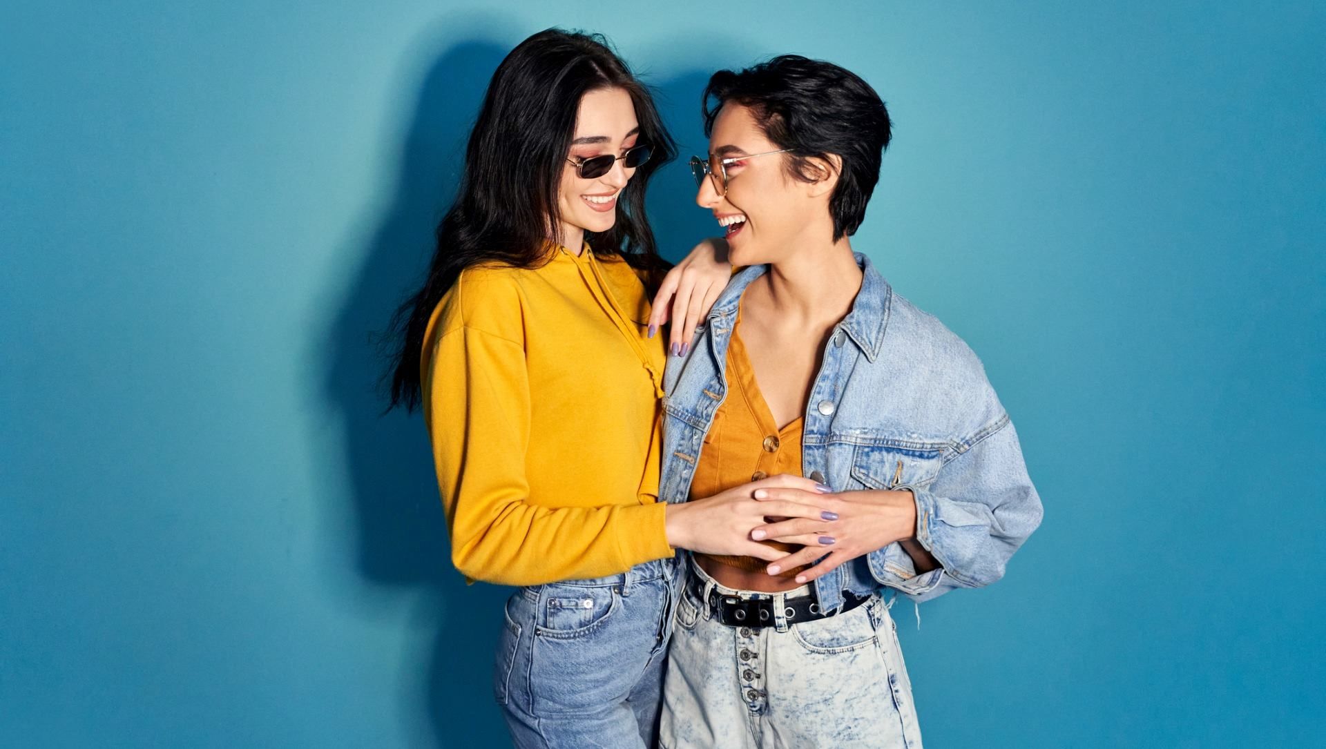 Happy LGBTQI+ couple wearing designer clothes - Cashrewards.jpg